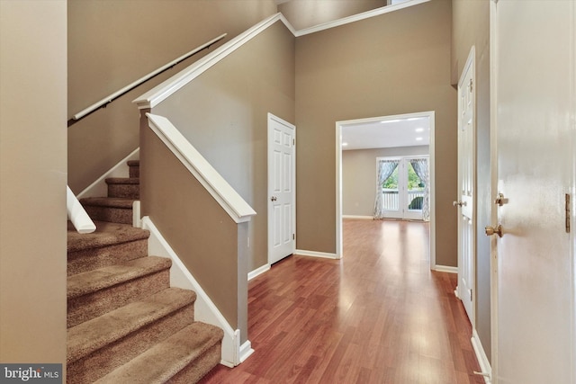 131 Red Haven Dr, North Wales, PA 19454 - foyer featuring stairway, wood finished floors, a high ceiling, baseboards, and ornamental molding