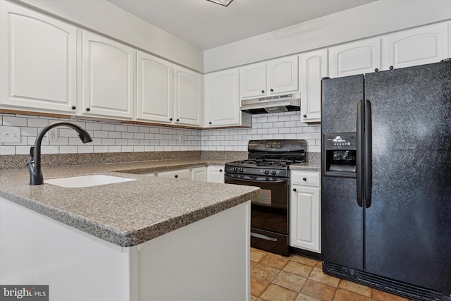 131 Red Haven Dr, North Wales, PA 19454 - kitchen featuring black appliances, under cabinet range hood, a sink, white cabinetry, and decorative backsplash