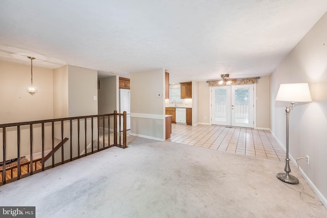 7037 Macbeth Way, Sykesville, MD 21784 - empty room featuring light colored carpet, baseboards, light tile patterned floors, and french doors