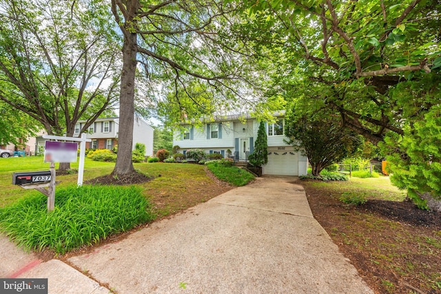 7037 Macbeth Way, Sykesville, MD 21784 - view of front of home with a garage, concrete driveway, and a front lawn