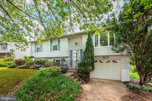 7037 Macbeth Way, Sykesville, MD 21784 - bi-level home featuring an attached garage and concrete driveway