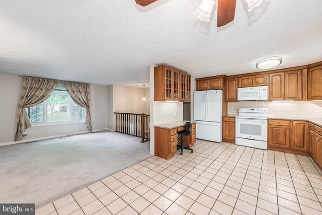 7037 Macbeth Way, Sykesville, MD 21784 - kitchen featuring white appliances, open floor plan, brown cabinets, light countertops, and a desk