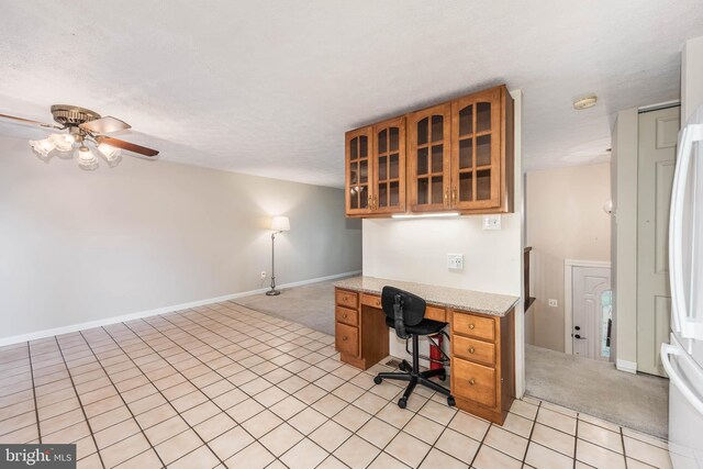 7037 Macbeth Way, Sykesville, MD 21784 - unfurnished office with built in desk, a ceiling fan, light tile patterned flooring, and light colored carpet