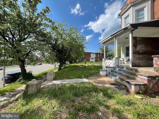 view of yard featuring a porch