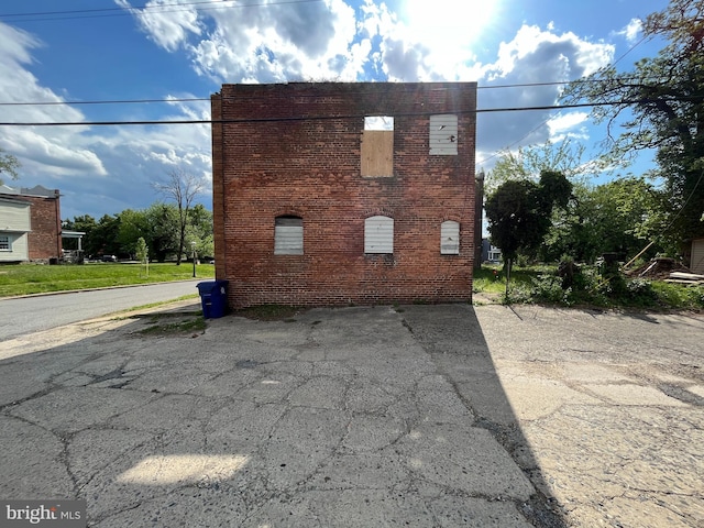 view of home's exterior with brick siding