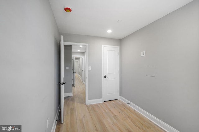 unfurnished bedroom with light wood-style flooring, recessed lighting, and baseboards