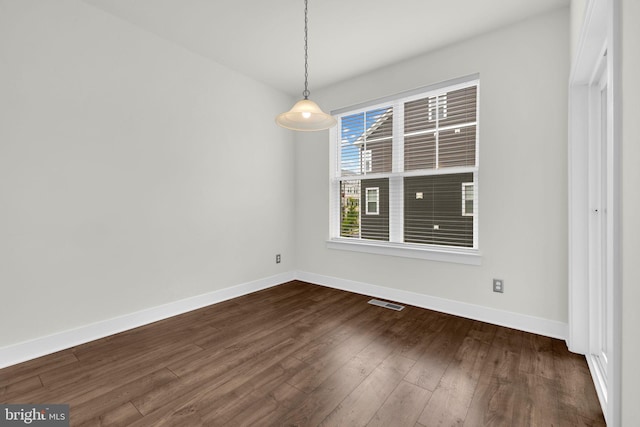 1552 Meadowlark Glen Rd, Dumfries, VA 22026 - unfurnished dining area with baseboards and dark wood-style flooring
