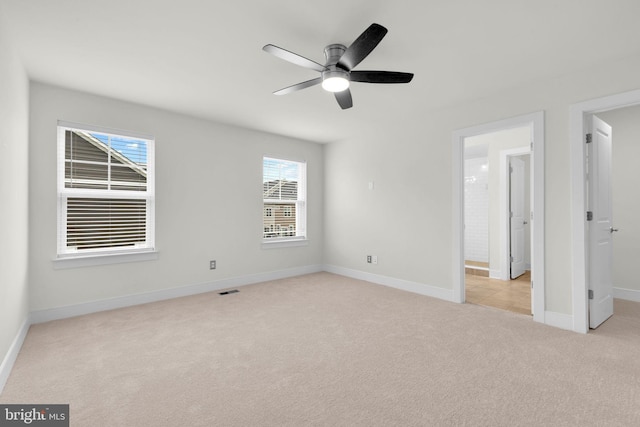 1552 Meadowlark Glen Rd, Dumfries, VA 22026 - unfurnished bedroom featuring light carpet, baseboards, ceiling fan, and a spacious closet