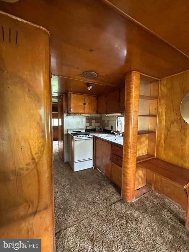 6528 Rte 6, Wellsboro, PA 16901 - kitchen featuring electric range, brown cabinets, dark carpet, and a sink