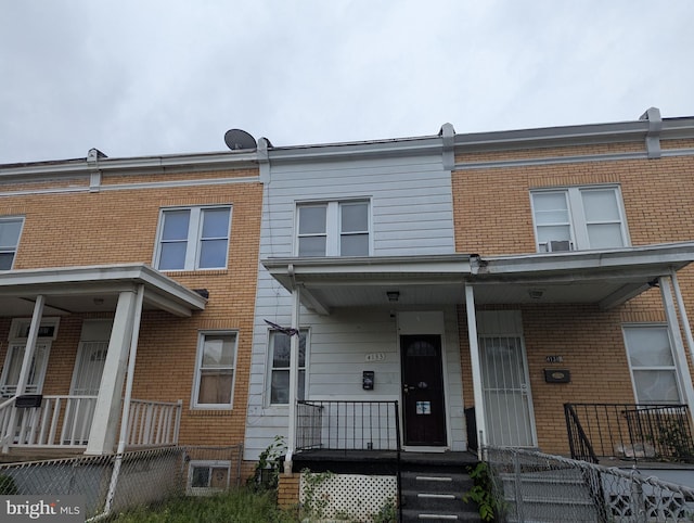 4133 Eierman Ave, Baltimore, MD 21206 - townhome / multi-family property with a porch and brick siding