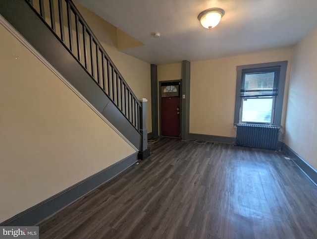 4133 Eierman Ave, Baltimore, MD 21206 - foyer entrance featuring radiator, dark wood-type flooring, baseboards, and stairs