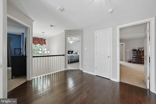 5280 Gunston Hall Dr, Woodbridge, VA 22193 - unfurnished living room featuring a chandelier, hardwood / wood-style floors, a ceiling fan, and baseboards