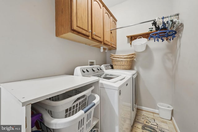 5280 Gunston Hall Dr, Woodbridge, VA 22193 - laundry area featuring cabinet space, washing machine and dryer, and baseboards