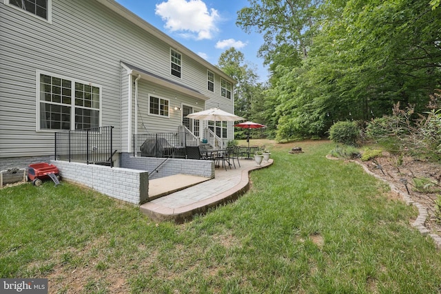 5280 Gunston Hall Dr, Woodbridge, VA 22193 - rear view of house with a patio and a lawn