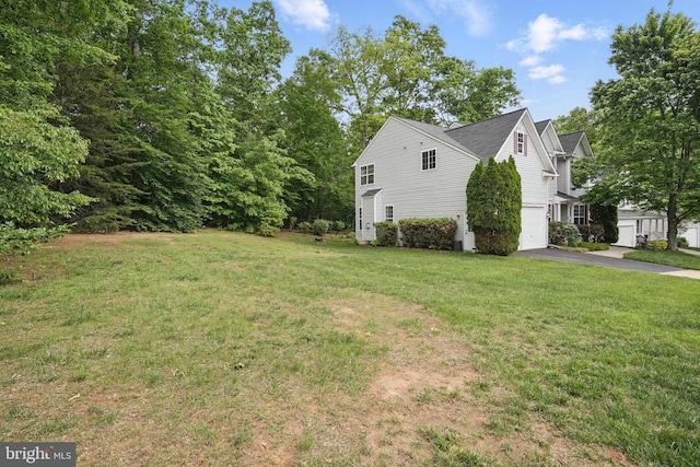 5280 Gunston Hall Dr, Woodbridge, VA 22193 - view of green lawn featuring asphalt driveway and a garage