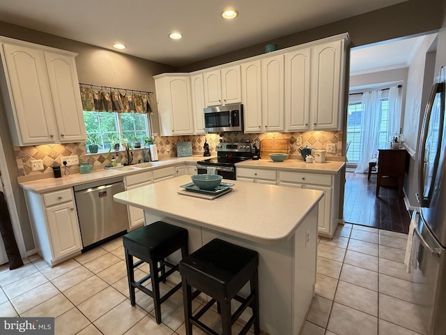 5280 Gunston Hall Dr, Woodbridge, VA 22193 - kitchen with appliances with stainless steel finishes, a sink, healthy amount of natural light, white cabinets, and recessed lighting