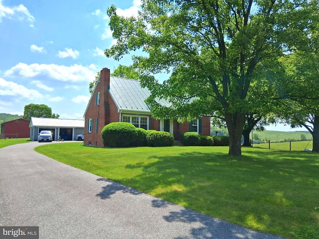 234 Bethel Grange Rd, Winchester, VA 22603 - view of front facade featuring a standing seam roof, a chimney, a garage, brick siding, and metal roof