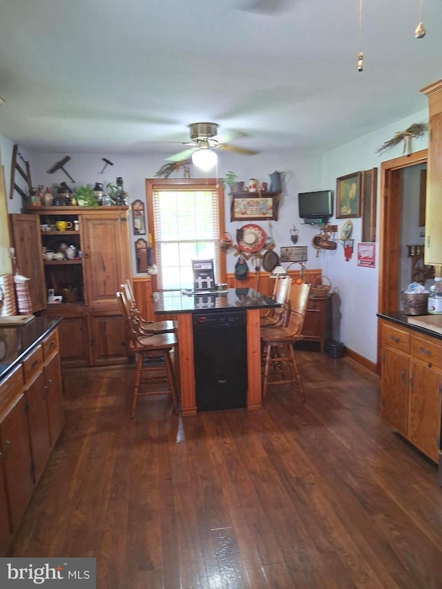 234 Bethel Grange Rd, Winchester, VA 22603 - kitchen with black dishwasher, ceiling fan, dark countertops, dark wood-style floors, and brown cabinetry