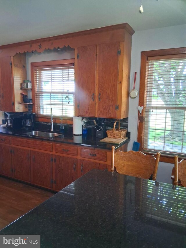234 Bethel Grange Rd, Winchester, VA 22603 - kitchen with a sink, brown cabinetry, and wood finished floors