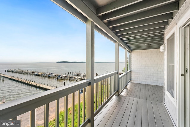 wooden deck with a water view