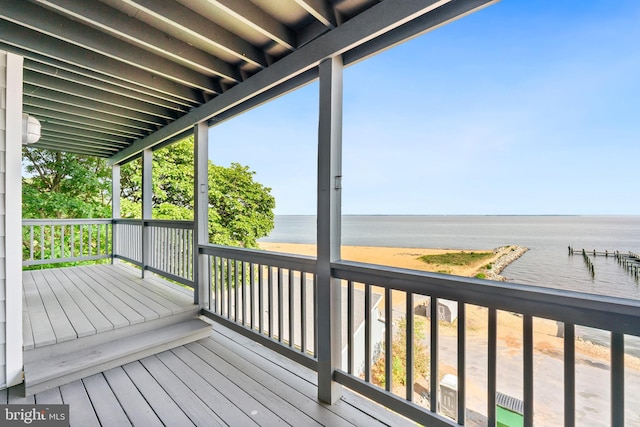 wooden deck featuring a water view