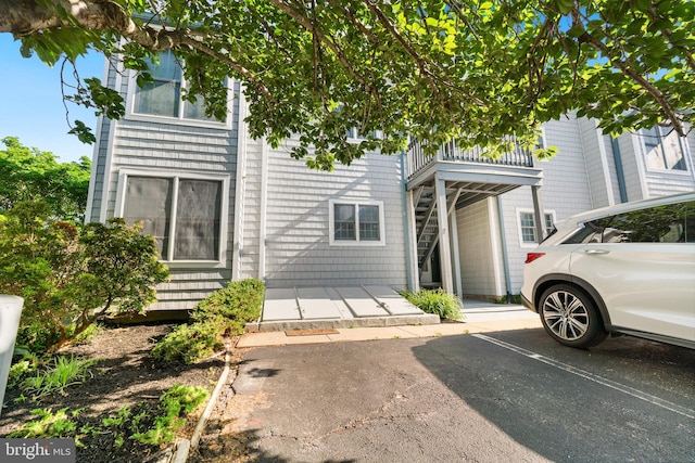 multi unit property featuring uncovered parking