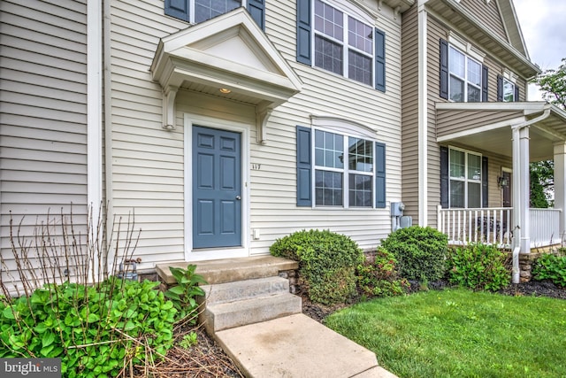 entrance to property featuring a porch
