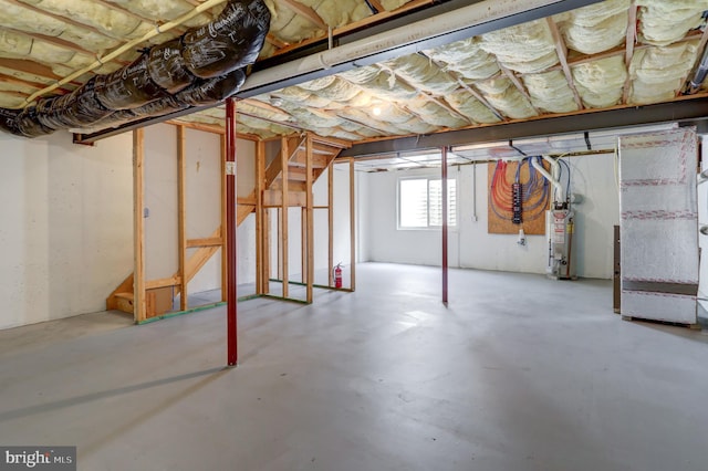 basement with gas water heater and heating unit