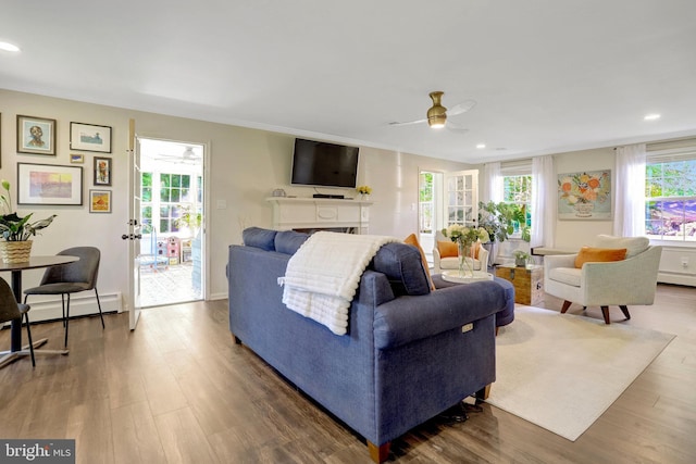 104 River Forest Ln, Fort Washington, MD 20744 - living room with ceiling fan, recessed lighting, wood finished floors, and a baseboard radiator