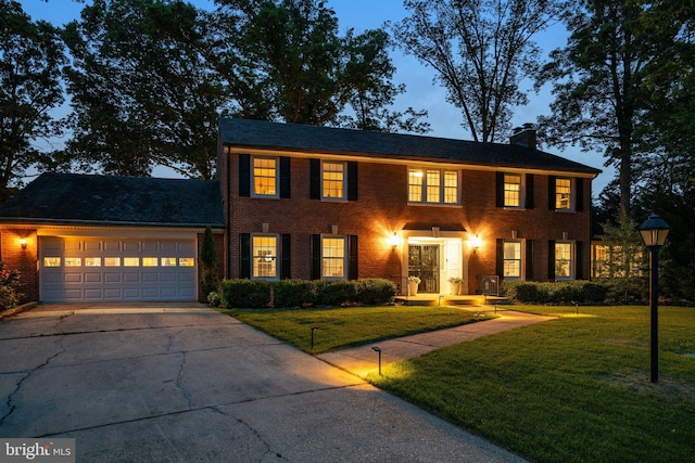 104 River Forest Ln, Fort Washington, MD 20744 - colonial inspired home featuring driveway, a garage, a front yard, and a chimney
