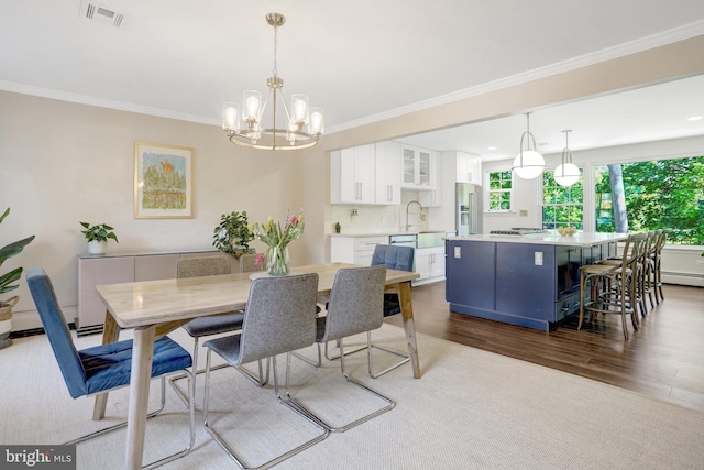 104 River Forest Ln, Fort Washington, MD 20744 - dining space featuring dark wood finished floors, crown molding, a chandelier, and a baseboard heating unit