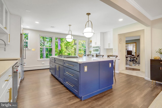 104 River Forest Ln, Fort Washington, MD 20744 - kitchen featuring stainless steel appliances, a baseboard radiator, blue cabinets, white cabinets, and light countertops
