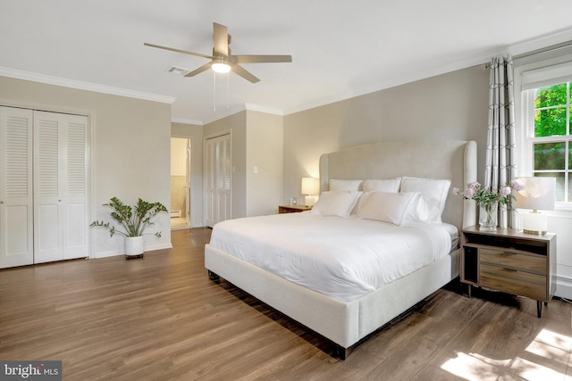 104 River Forest Ln, Fort Washington, MD 20744 - bedroom featuring wood finished floors, crown molding, multiple closets, baseboards, and ceiling fan