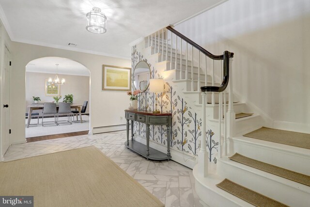 104 River Forest Ln, Fort Washington, MD 20744 - entryway featuring arched walkways, a baseboard radiator, stairs, ornamental molding, and a chandelier