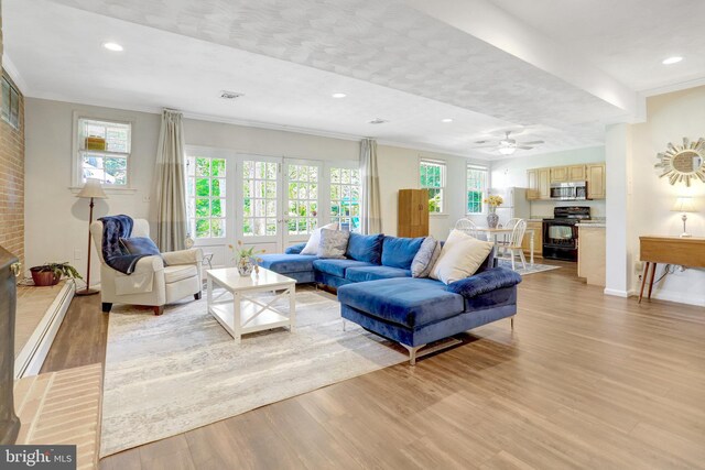 104 River Forest Ln, Fort Washington, MD 20744 - living room with light wood-type flooring, healthy amount of natural light, recessed lighting, ornamental molding, and baseboards
