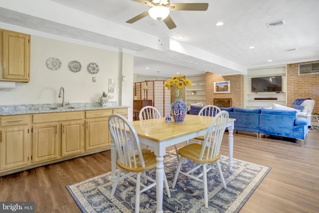 104 River Forest Ln, Fort Washington, MD 20744 - dining room with a ceiling fan, a fireplace, wood finished floors, recessed lighting, and ornamental molding