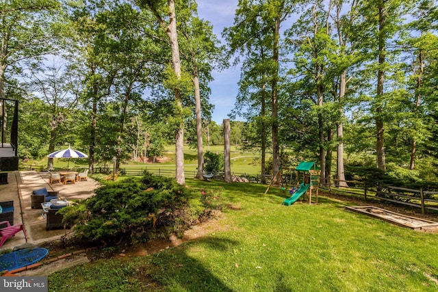 104 River Forest Ln, Fort Washington, MD 20744 - view of yard featuring a playground, a patio area, and view of wooded area