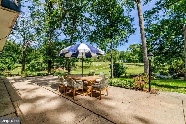 104 River Forest Ln, Fort Washington, MD 20744 - view of patio / terrace with outdoor dining space and view of scattered trees