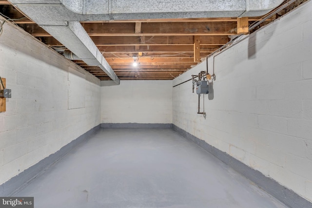 unfinished below grade area featuring gas meter