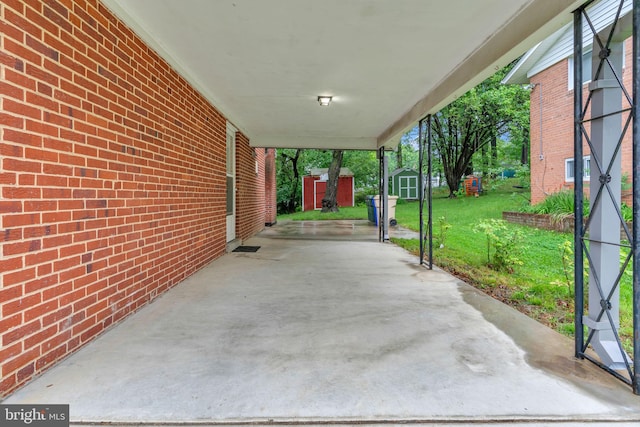 view of patio / terrace with a storage unit and an outbuilding