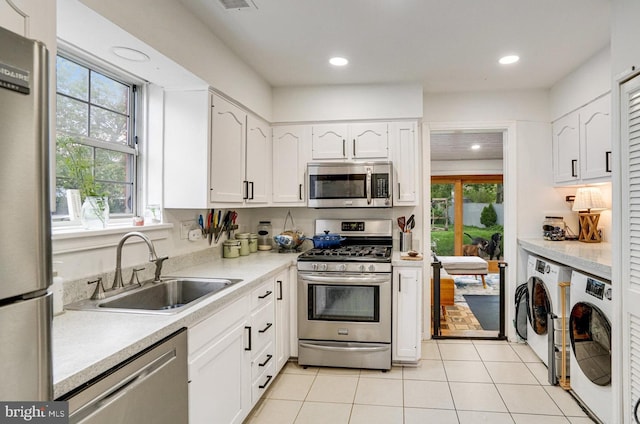 8102 Wingfield Pl, Alexandria, VA 22308 - kitchen with stainless steel appliances, a sink, white cabinetry, healthy amount of natural light, and recessed lighting