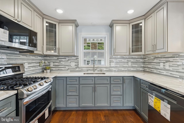 7608 Avondale Ave, Baltimore, MD 21224 - kitchen with stainless steel appliances, a sink, and gray cabinetry