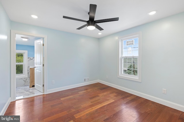 7608 Avondale Ave, Baltimore, MD 21224 - spare room featuring wood finished floors, healthy amount of natural light, ceiling fan, and recessed lighting