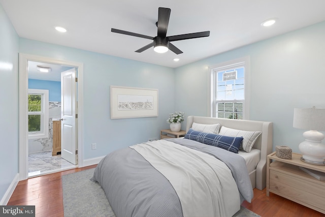 7608 Avondale Ave, Baltimore, MD 21224 - bedroom with multiple windows, wood finished floors, baseboards, and recessed lighting