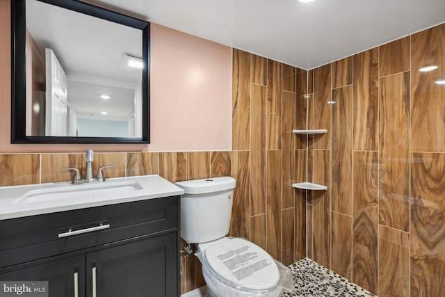 7608 Avondale Ave, Baltimore, MD 21224 - full bathroom featuring tile walls, vanity, tiled shower, and toilet