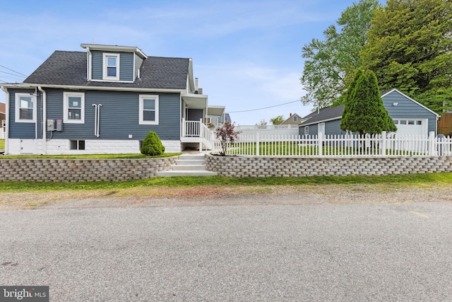 7608 Avondale Ave, Baltimore, MD 21224 - bungalow-style house with a garage, fence, an outdoor structure, and a shingled roof