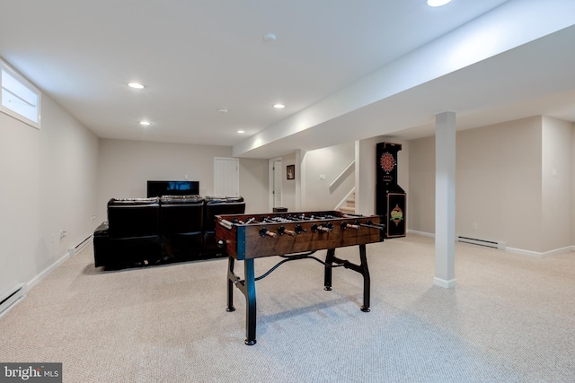 recreation room with light carpet, baseboard heating, recessed lighting, and baseboards