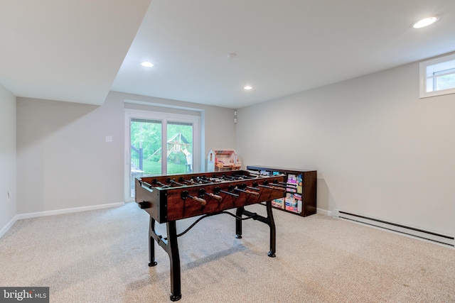 recreation room with carpet floors, baseboards, recessed lighting, and baseboard heating