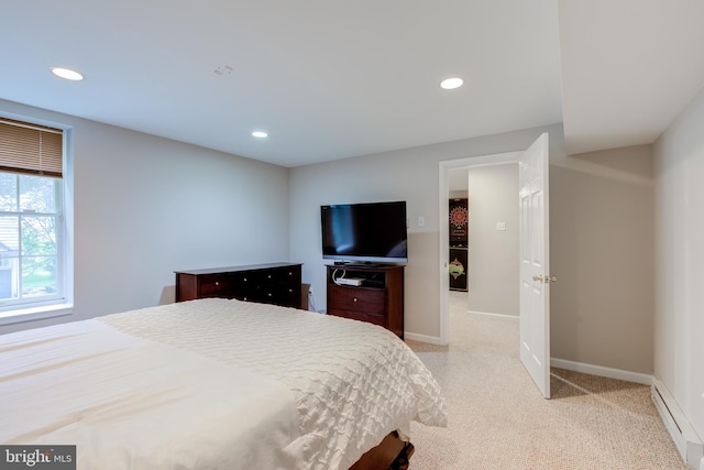 bedroom featuring a baseboard radiator, baseboards, recessed lighting, and light colored carpet