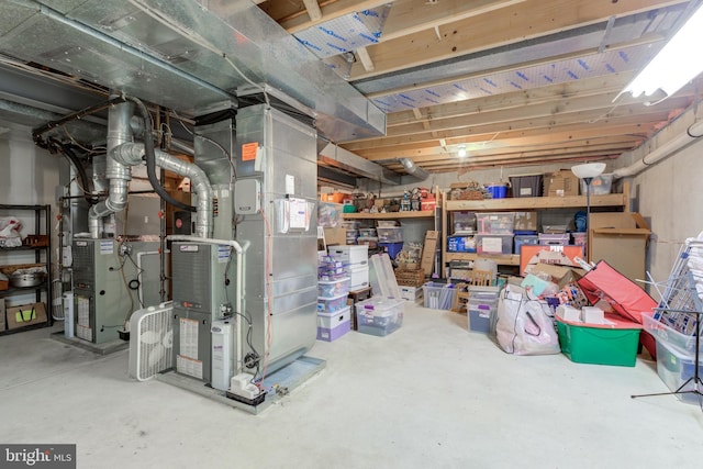 unfinished below grade area featuring heating unit